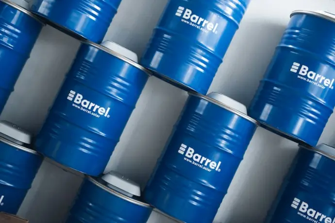 alt="Stacked blue barrels with the Barrel logo, designed for sustainable energy storage solutions"