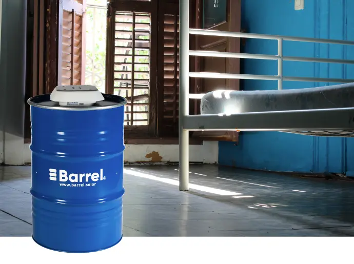 title="Barrel solar energy system offering sustainable power for indoor spaces" alt="Barrel solar energy system in a room with a bed, providing sustainable energy solutions"